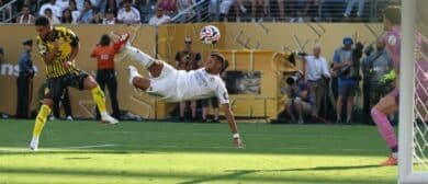 Real Madrid CF forward Kylian Mbappe (9) scores a goal against Borussia Dortmund goalkeeper Gregor Kobel (1) in the second half during a quarterfinal match of the 2025 FIFA Club World Cup at MetLife Stadium.