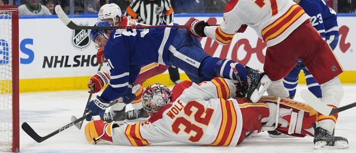 Toronto Maple Leafs forward John Tavares (91) tries to score against Calgary Flames goaltender Dustin Wolf (32) during the third period at Scotiabank Arena