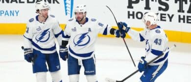 Tampa Bay Lightning right wing Nikita Kucherov (86) celebrates with center Brayden Point (21) and defenseman Darren Raddysh (43) after scoring a goal against the Vegas Golden Knights during the third period at T-Mobile Arena