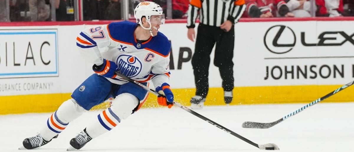 Edmonton Oilers center Connor McDavid (97) skates with the puck against the Carolina Hurricanes during the third period at Lenovo Center.