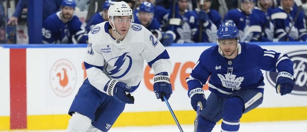 Tampa Bay Lightning forward Brayden Point (21) carries the puck as Toronto Maple Leafs forward Max Domi (11) pursues during the second period at Scotiabank Arena