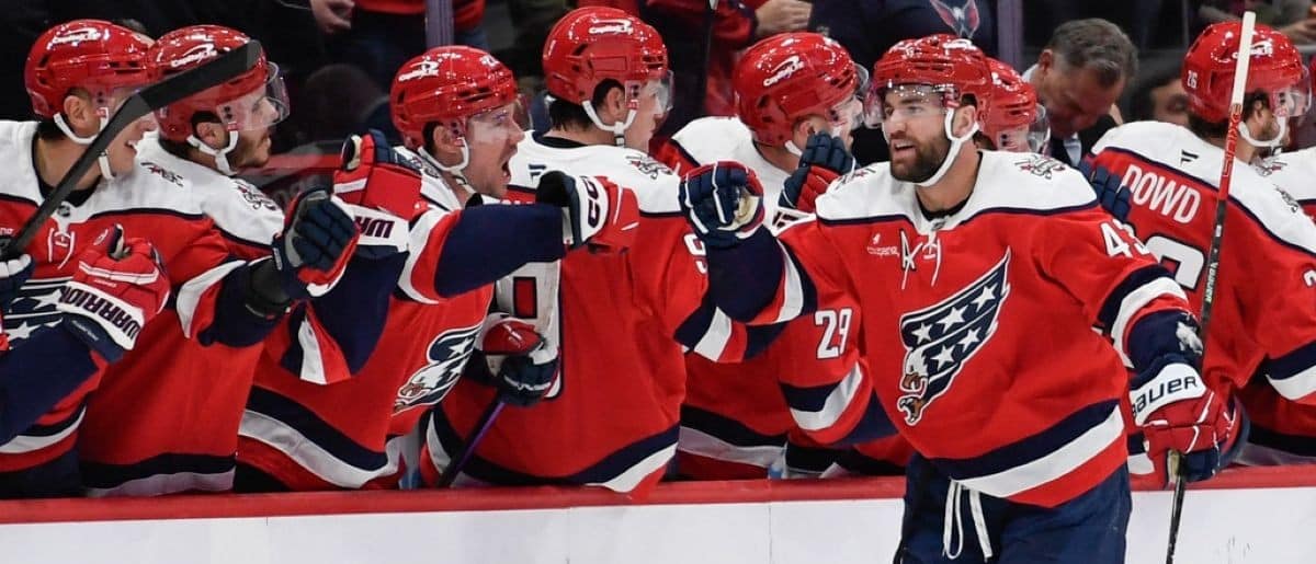 Washington Capitals right wing Tom Wilson (43) celebrates with teammates after scoring a goal against the New York Rangers during the second period at Capital One Arena