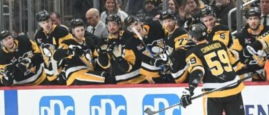 Pittsburgh Penguins right wing Egor Chinakhov (59) is greeted by his teammates after scoring on the Columbus Blue Jackets at PPG Paints Arena.