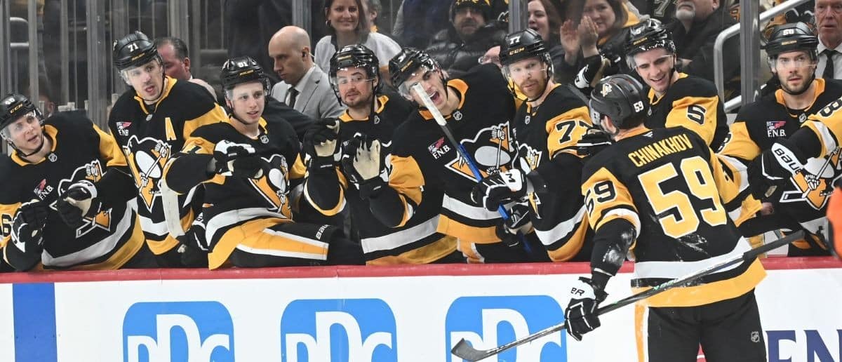 Pittsburgh Penguins right wing Egor Chinakhov (59) is greeted by his teammates after scoring on the Columbus Blue Jackets at PPG Paints Arena.
