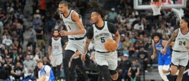 San Antonio Spurs guard Stephon Castle (5) dribbles up the court in front of forward Victor Wembanyama (1) in the first half at Frost Bank Center.