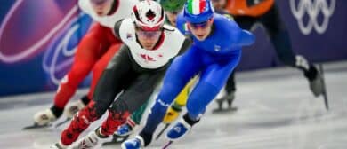 William Dandjinou of Canada skates in a men's 1500m quarterfinal heat during the Milano Cortina 2026 Olympic Winter Games at Milano Ice Skating Arena.