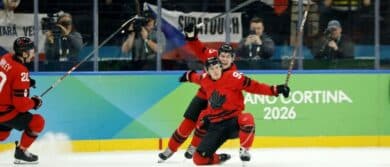 Mitch Marner of Canada celebrates with Thomas Harley after scoring their fourth and game-winning goal against Czechia in a men's ice hockey quarterfinal during the Milano Cortina 2026 Olympic Winter Games at Milano Santagiulia Ice Hockey Arena