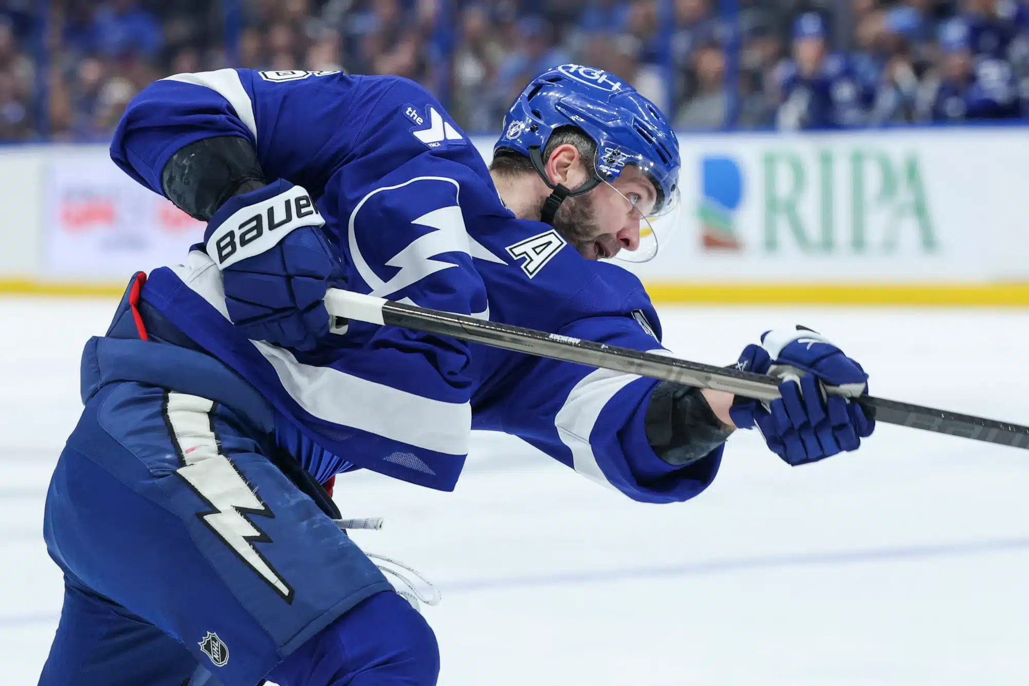 Dec 22, 2025; Tampa, Florida, USA; Tampa Bay Lightning right wing Nikita Kucherov (86) shoots the puck against the St. Louis Blues in the first period at Benchmark International Arena.