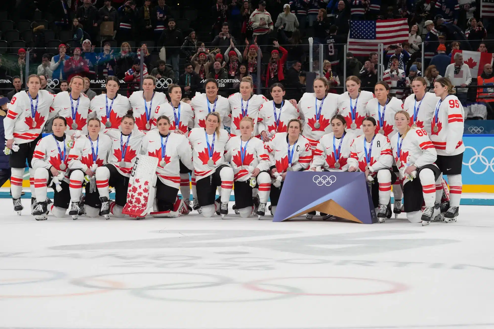 Feb 19, 2026; Milan, Italy; Canada players pose for a photo with their silver medals after playing against the United States in the women's ice hockey gold medal game during the Milano Cortina 2026 Olympic Winter Games at Milano Santagiulia Ice Hockey Arena. 