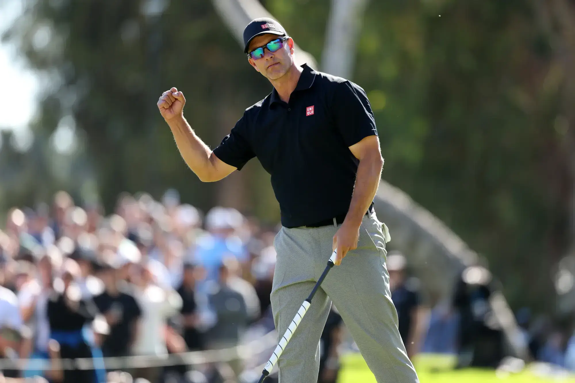 Feb 22, 2026; Pacific Palisades, California, USA; Adam Scott reacts after making a birdie putt on the 18th green during the final round of the The Genesis Invitational golf tournament at Riviera Country Club. 