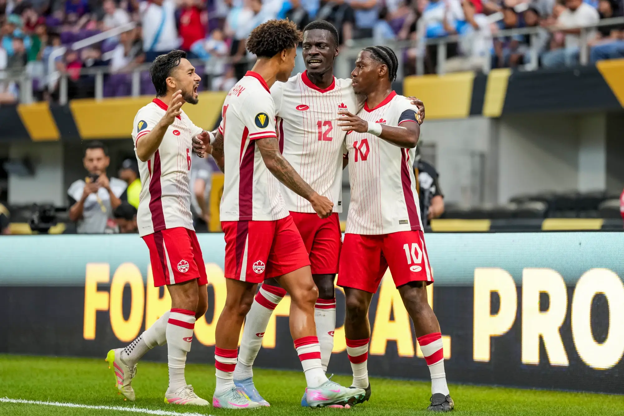 Jun 29, 2025; Minneapolis, Minnesota, USA; Canada forward Jonathan David (10) celebrates scoring a penalty goal with teammates during the first half during a quarterfinal match of the 2025 Gold Cup at U.S. Bank Stadium. 