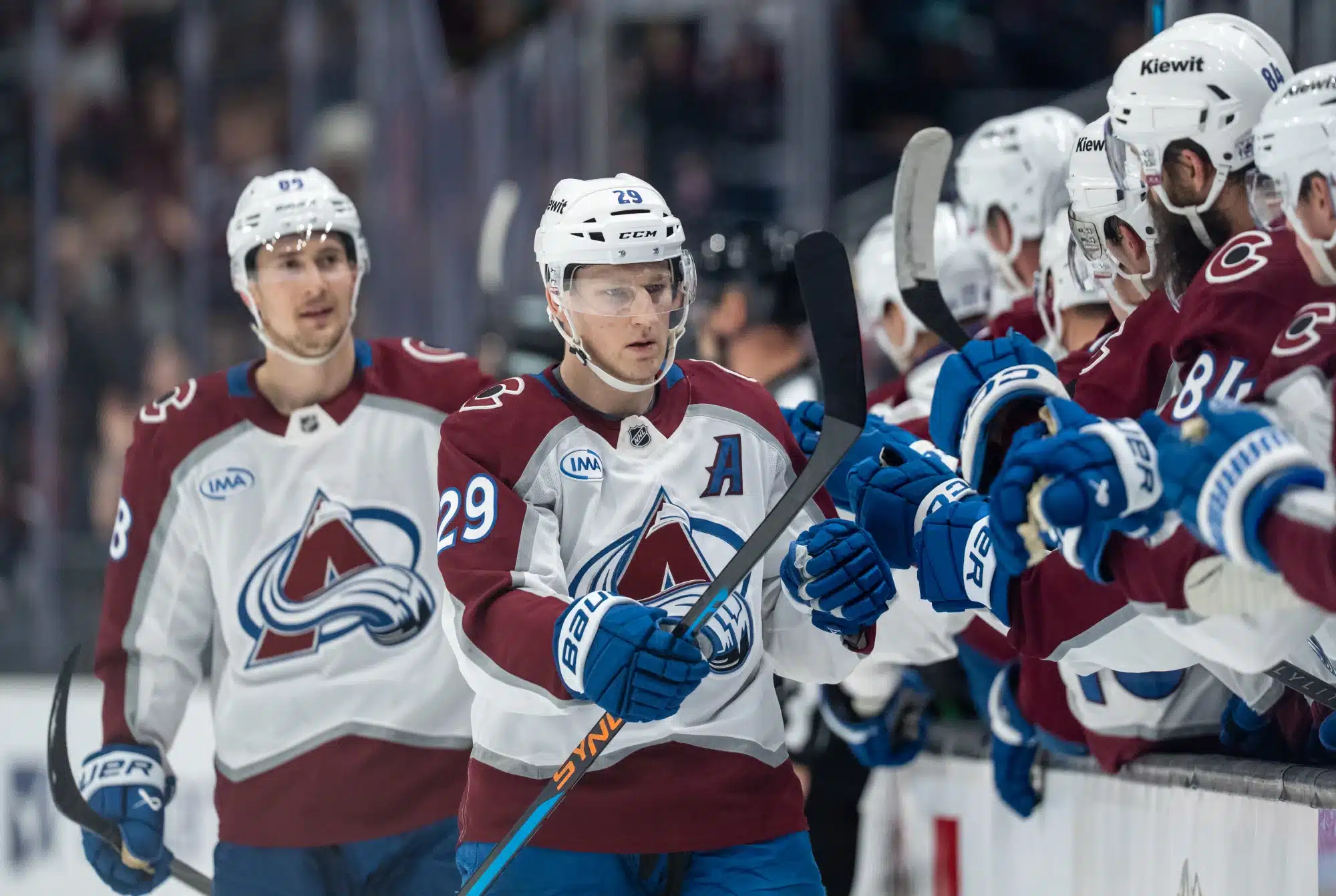 Mar 12, 2026; Seattle, Washington, USA; Colorado Avalanche forward Nathan MacKinnon (29) celebrates a goal with teammates on the bench during the first period against the Seattle Kraken at Climate Pledge Arena.