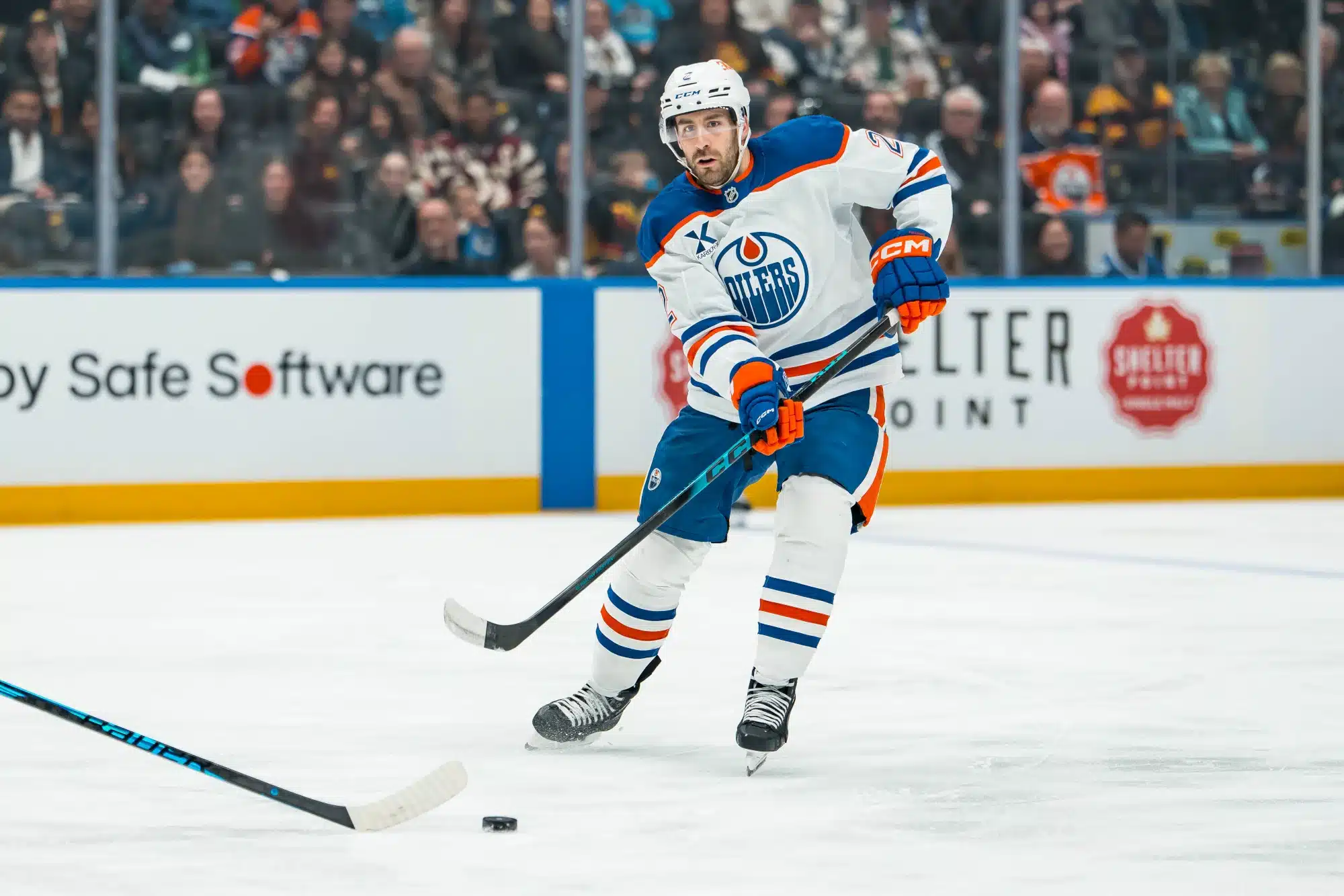 Jan 17, 2026; Vancouver, British Columbia, CAN; Edmonton Oilers defenseman Evan Bouchard (2) makes a pass against the Vancouver Canucks in the first period at Rogers Arena.