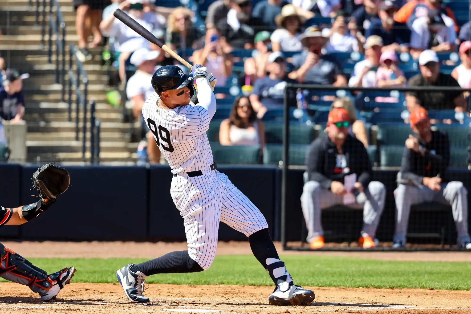 Feb 21, 2026; Tampa, Florida, USA; New York Yankees outfielder Aaron Judge (99) hits a home run against the Detroit Tigers during the third inning in a Spring Training game at George M. Steinbrenner Field. 