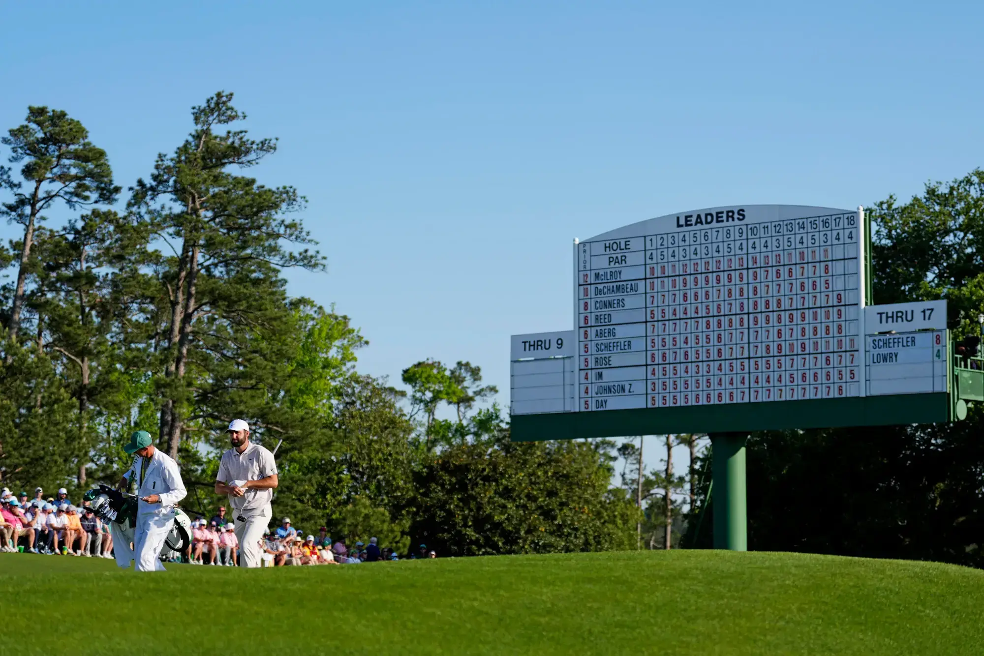 Apr 13, 2025; Augusta, Georgia, USA; Scottie Scheffler walks up to the 18th green during the final round of the Masters Tournament at Augusta National Golf Club.
