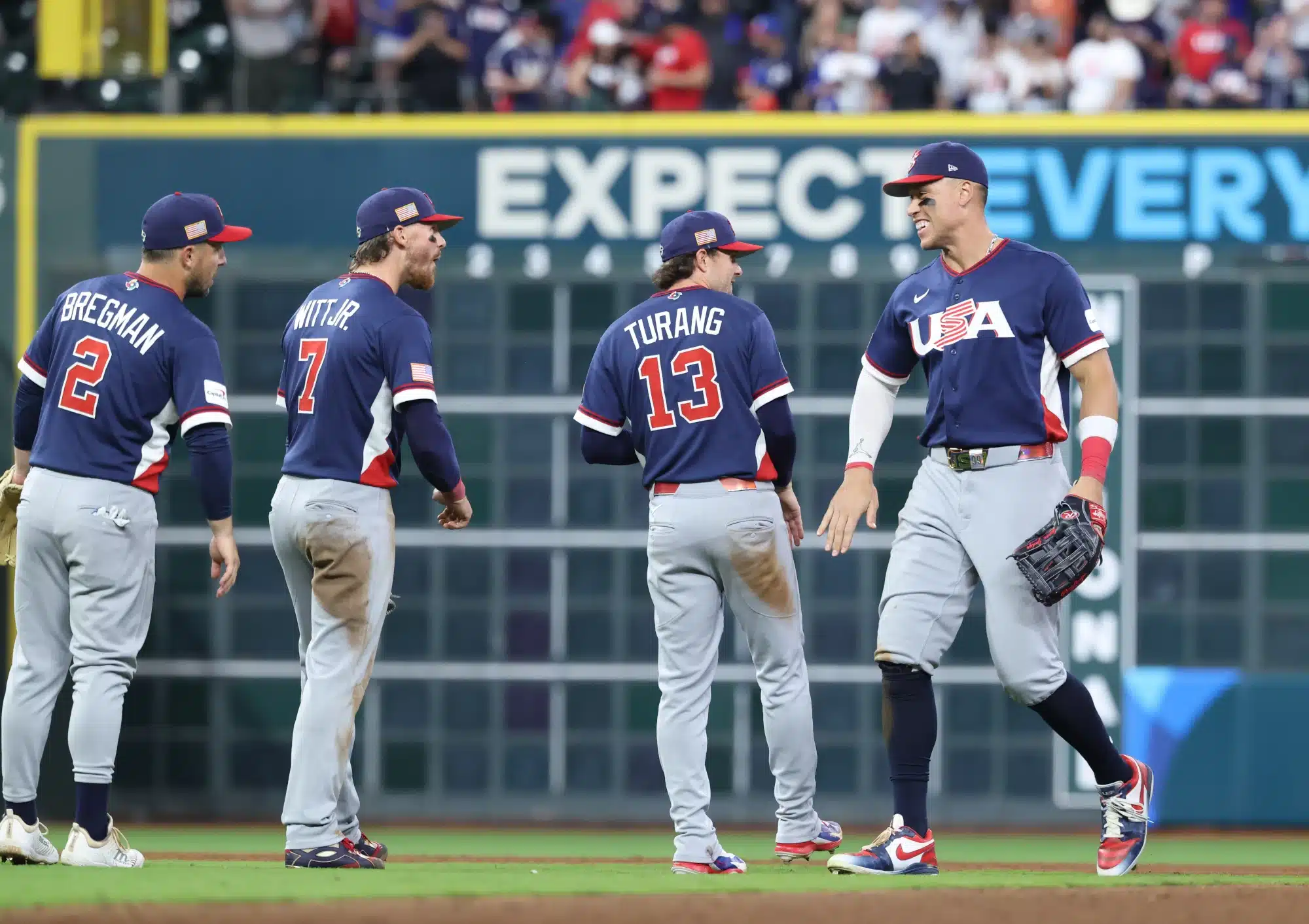 Mar 13, 2026; Houston, TX, United States; United States right fielder Aaron Judge (99), second baseman Brice Turang (13), shortstop Bobby Witt Jr. (7) and third baseman Alex Bregman (2) celebrate after defeating Canada during a quarterfinal game of the 2026 World Baseball Classic at Daikin Park.