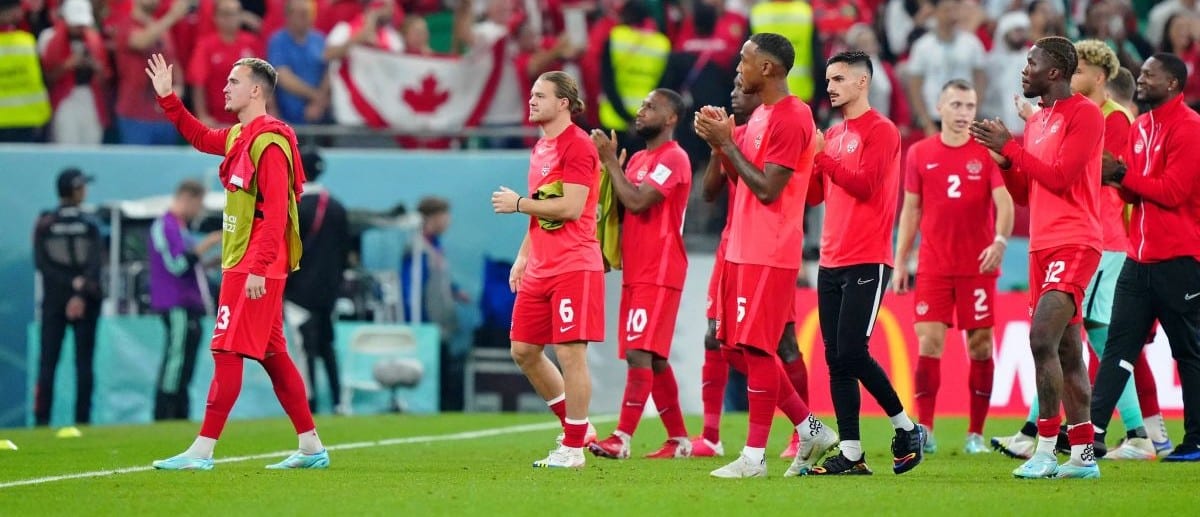 Canada acknowledges fans after losing a group stage match against Morocco during the 2022 World Cup at Al Thumama Stadium.