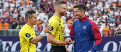 Barcelona forward Robert Lewandowski (9) shakes hands with officials before an international friendly against Real Madrid at MetLife Stadium