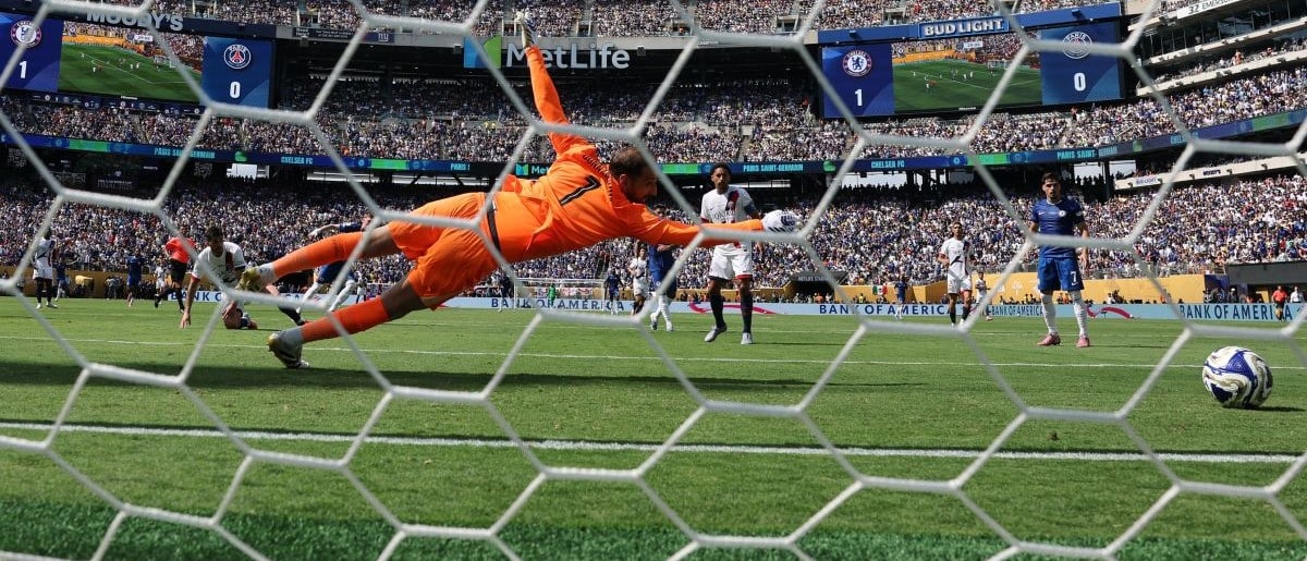 Paris Saint-Germain goalkeeper Gianluigi Donnarumma (1) gives up a goal against Chelsea FC midfielder Cole Palmer (n) to pictured) during the final of the 2025 FIFA Club World Cup at MetLife Stadium