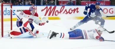 Montreal Canadiens goaltender Sam Montembeault (35) stops the puck as Toronto Maple Leafs center Dakota Joshua (81) looks for the rebound during the first period at Scotiabank Arena.