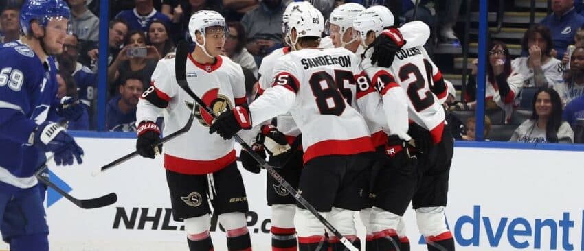 Ottawa Senators center Dylan Cozens (24) is congratulated after he scored a goal against the Tampa Bay Lightning during the first period at Benchmark International Arena