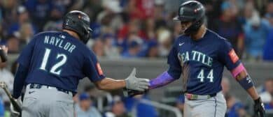 Seattle Mariners center fielder Julio Rodriguez (44) celebrates with first baseman Josh Naylor (12) after hitting a home run in the third inning against the Toronto Blue Jays during game seven of the ALCS round for the 2025 MLB playoffs at Rogers Centre