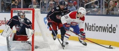 Montreal Canadiens left wing Juraj Slafkovsky (20) and Columbus Blue Jackets defenseman Ivan Provorov (9) battle for the puck during the first period at Nationwide Arena.