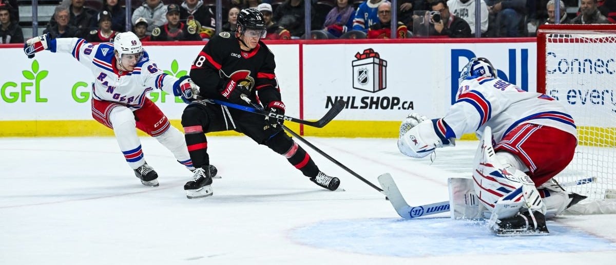 Ottawa Senators center Tim Stutzle (18) shoots the puck against New York Rangers goalie Igor Shesterkin (31) during the third period at Canadian Tire Centre.