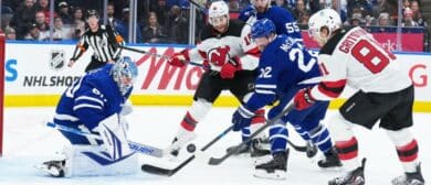 Toronto Maple Leafs defenseman Jake McCabe (22) battles for the puck with New Jersey Devils right wing Arseny Gritsyuk (81) during the second period at Scotiabank Arena.