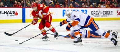 Calgary Flames right wing Matt Coronato (27) controls the puck against the New York Islanders during the second period at Scotiabank Saddledome