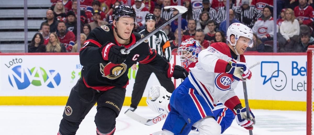 Ottawa Senators left wing Brady Tkachuk (7) and Montreal Canadiens defenseman Mike Matheson (8) chase the puck in the first period at the Canadian Tire Centre