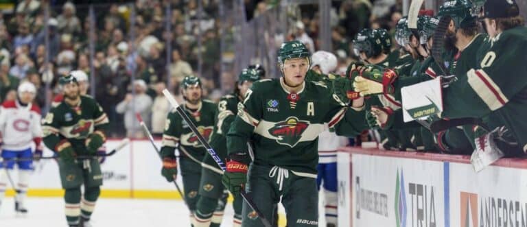 Minnesota Wild left wing Kirill Kaprizov (97) is congratulated by the bench after scoring on the Montreal Canadiens in the first period at Grand Casino Arena