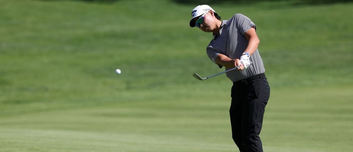 Min Woo Lee hits his chip shot on the second hole during the third round of the The Genesis Invitational golf tournament at Riviera Country Club