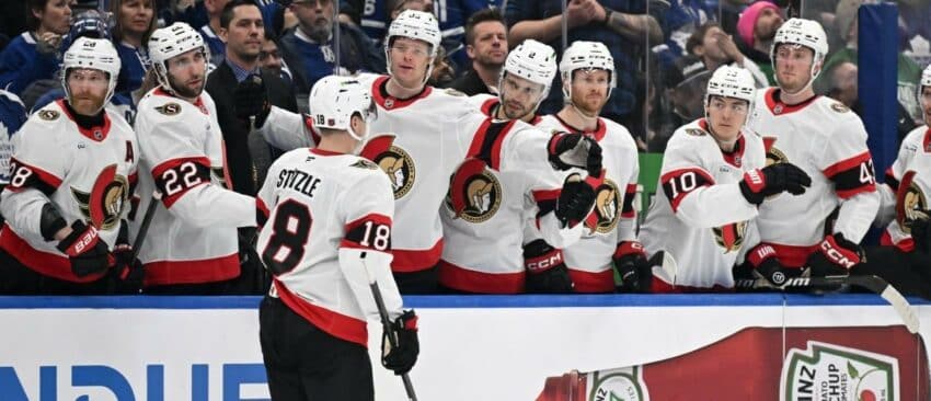 Ottawa Senators forward Tim Stutzle (18) celebrates with team mates at the bench after scoring a goal against the Toronto Maple Leafs in the second period at Scotiabank Arena.