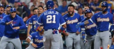 Venezuela right fielder Ronald Acuna Jr. (21) celebrates with teammates after hitting a home run against Japan in the first inning during a quarterfinal game of the 2026 World Baseball Classic at loanDepot Park.