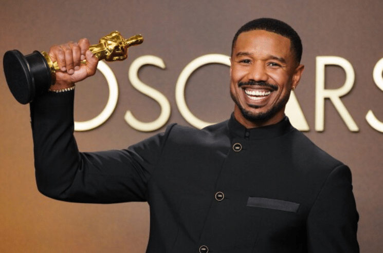 Michael B. Jordan (Sinners) holding the Best Actor Oscar at the 2026 Academy Awards.