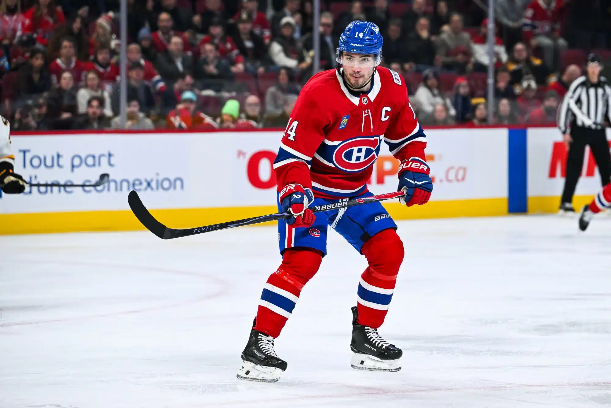 Mar 17, 2026; Montreal, Quebec, CAN; Montreal Canadiens center Nick Suzuki (14) skates against the Boston Bruins during the second period at Bell Centre. 