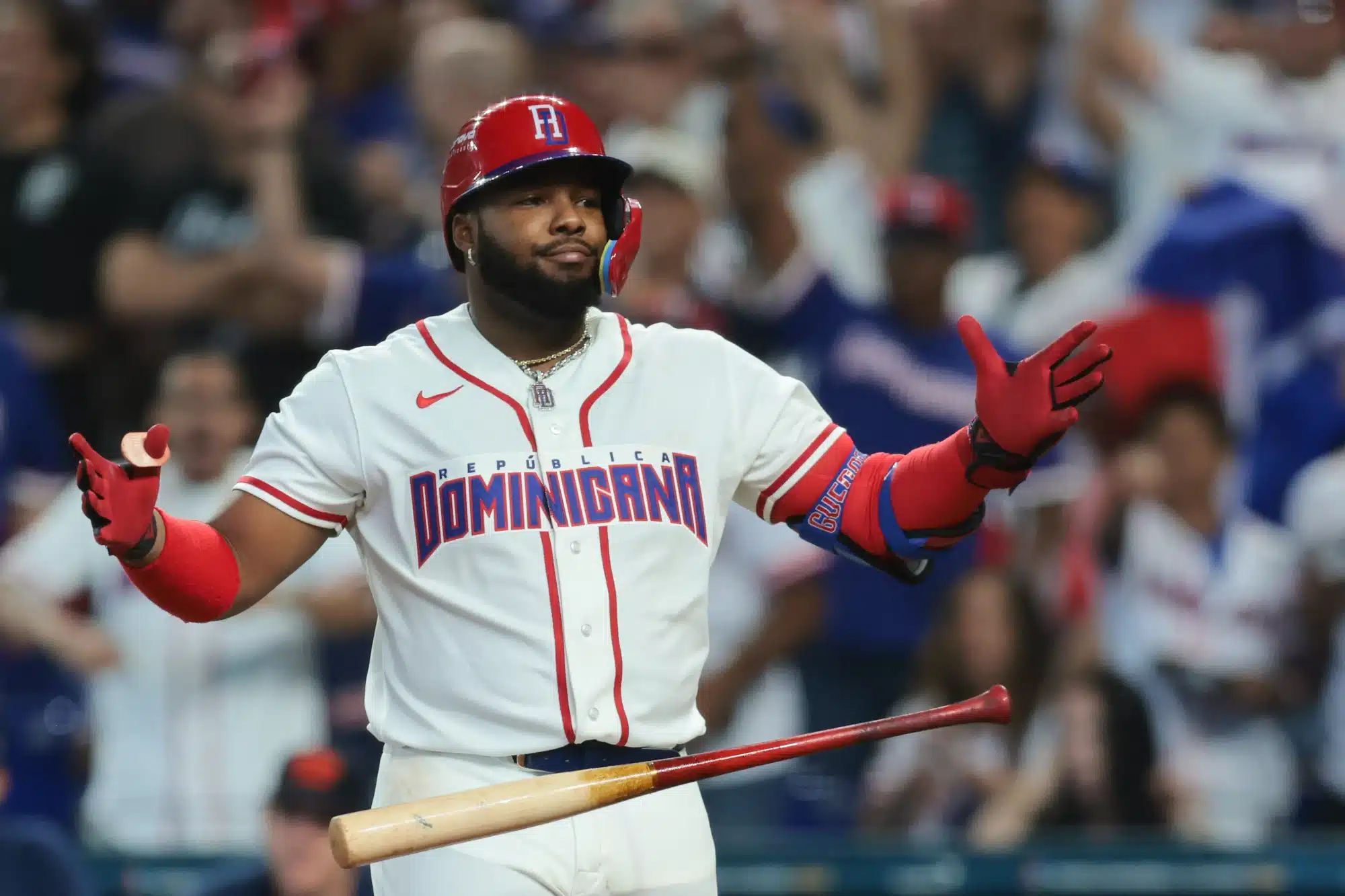 Mar 8, 2026; Miami, FL, United States; Dominican Republic first baseman Vladimir Guerrero Jr. (27) reacts after hitting a two-run home run against the Netherlands during the third inning at loanDepot Park. 