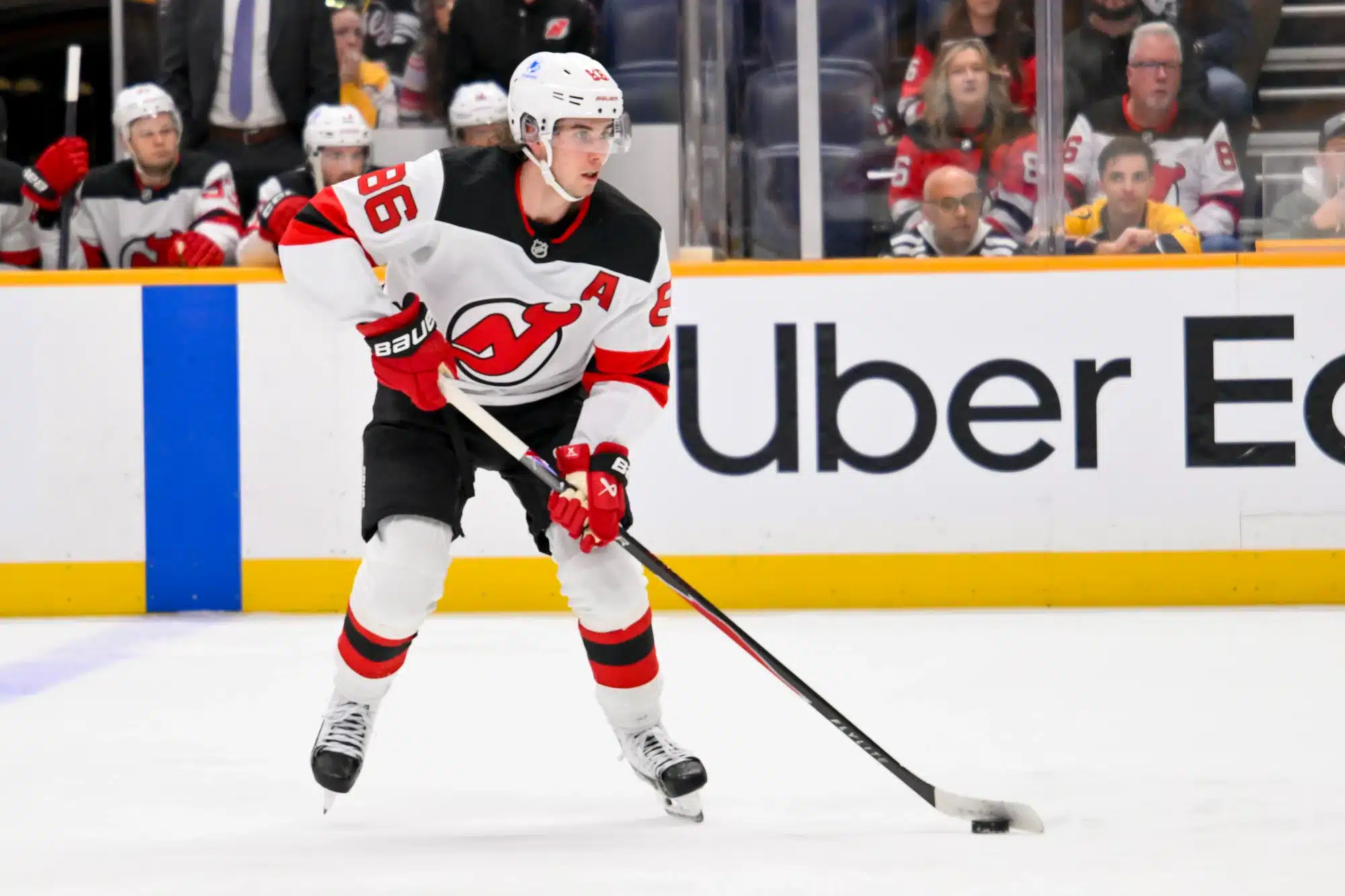 Mar 26, 2026; Nashville, Tennessee, USA; New Jersey Devils center Jack Hughes (86) skates with the puck against the New Jersey Devils during the second period at Bridgestone Arena.