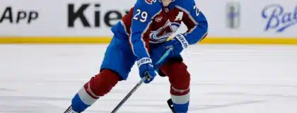 Apr 21, 2026; Denver, Colorado, USA; Colorado Avalanche center Nathan MacKinnon (29) controls the puck in the second period against the Los Angeles Kings in game two of the first round of the 2026 Stanley Cup Playoffs at Ball Arena.
