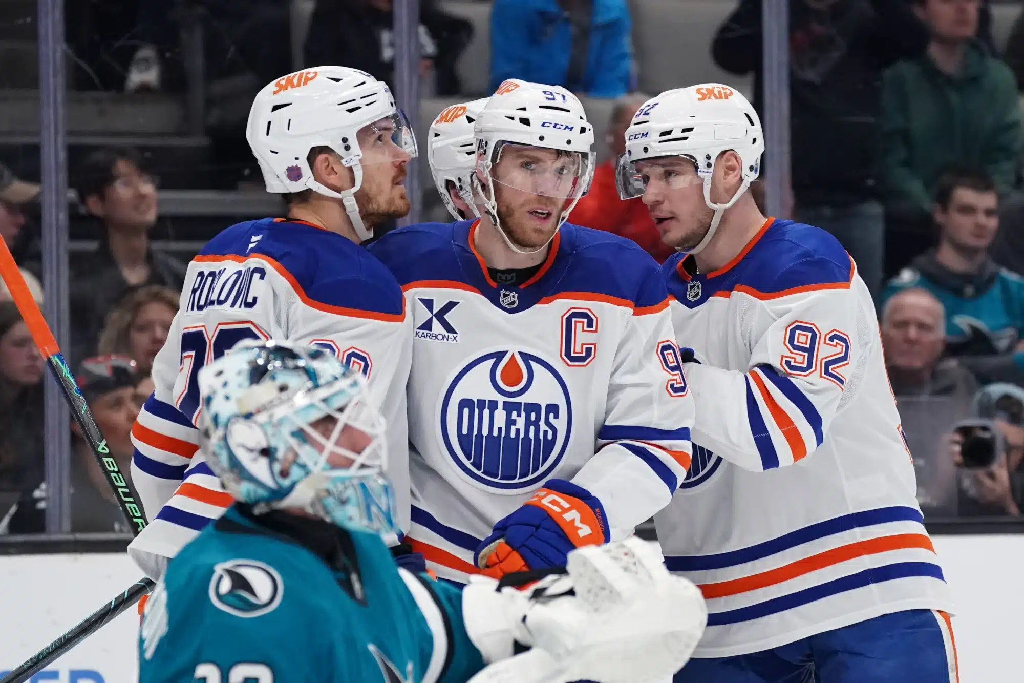 Apr 8, 2026; San Jose, California, USA; Edmonton Oilers center Connor McDavid (97) is congratulated by teammates after scoring against the San Jose Sharks during the first period at SAP Center at San Jose. 