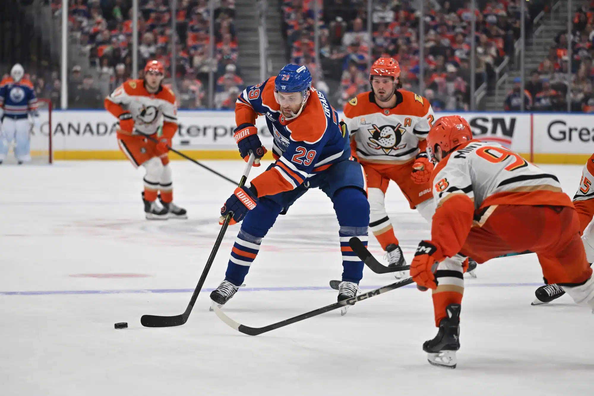 Apr 20, 2026; Edmonton, Alberta, CAN; Edmonton Oilers center Leon Draisaitl (29) and Anaheim Ducks defenseman Pavel Mintyukov (98) battle for the puck in game one of the first round of the 2026 Stanley Cup Playoffs during the third period at Rogers Place.