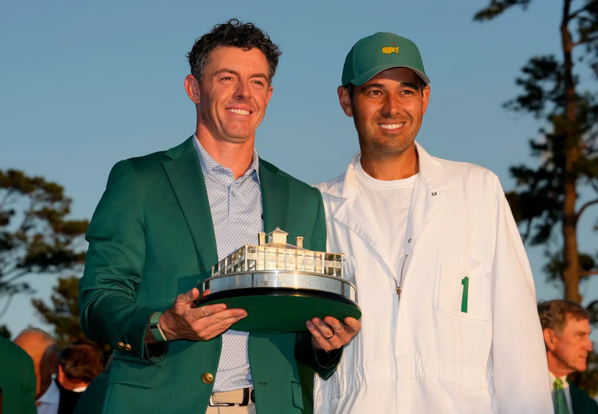 Apr 12, 2026; Augusta, Georgia, USA; Rory McIlroy poses for a photo with his caddie, Harry Diamond, with the Masters championship trophy during the green jacket ceremony after the final round of the Masters Tournament at Augusta National Golf Club. 
