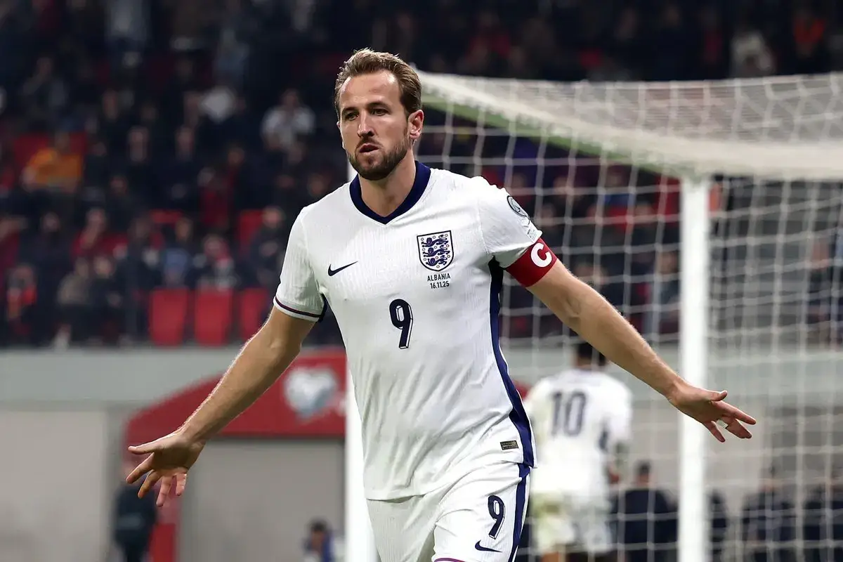 Team England captain Harry Kane celebrates scoring a goal in a soccer match.