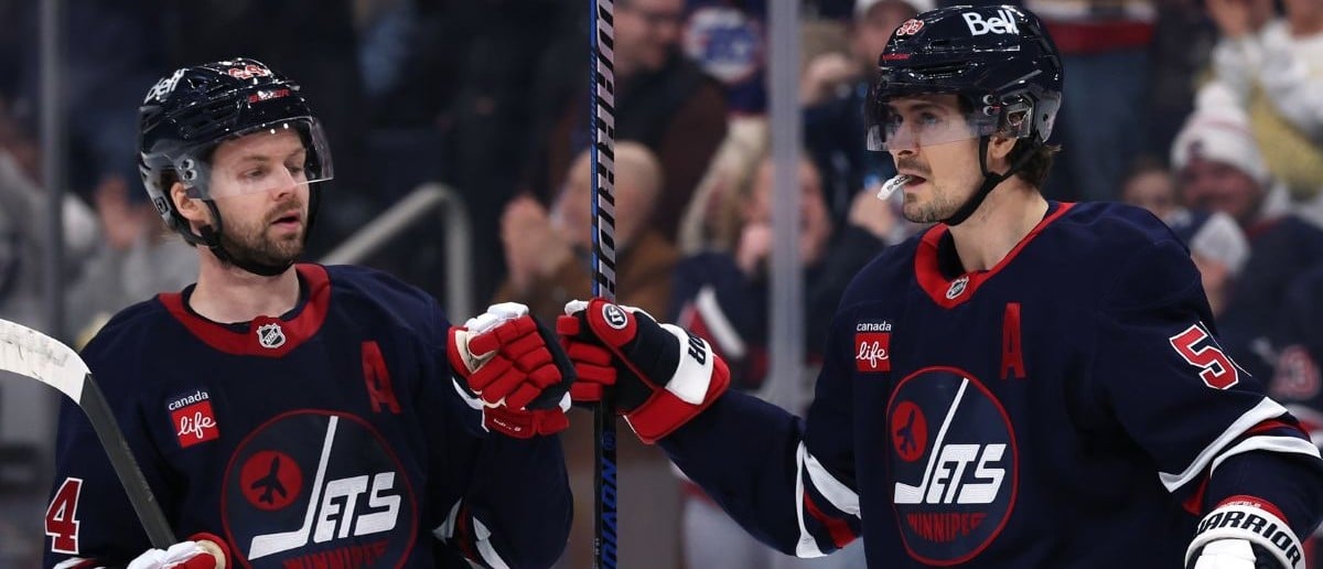 Winnipeg Jets center Mark Scheifele (55) celebrates his goal with Winnipeg Jets defenseman Josh Morrissey (44) against the Seattle Kraken in the second period at Canada Life Centre
