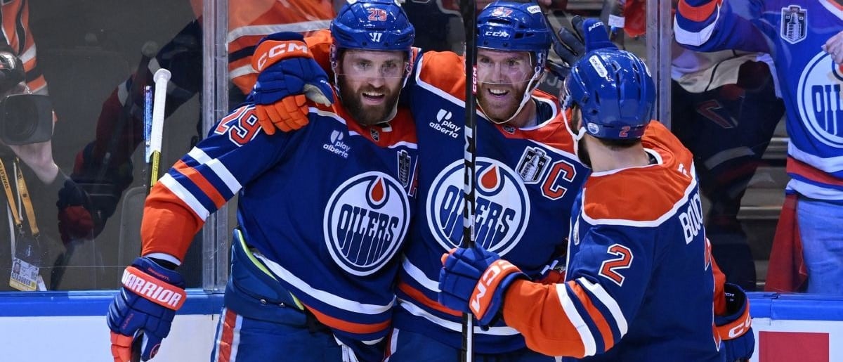 Edmonton Oilers center Leon Draisaitl (29) reacts with center Connor McDavid (97) and defenseman Evan Bouchard (2) after scoring a goal against the Florida Panthers during the first period in game two of the 2025 Stanley Cup Final at Rogers Place