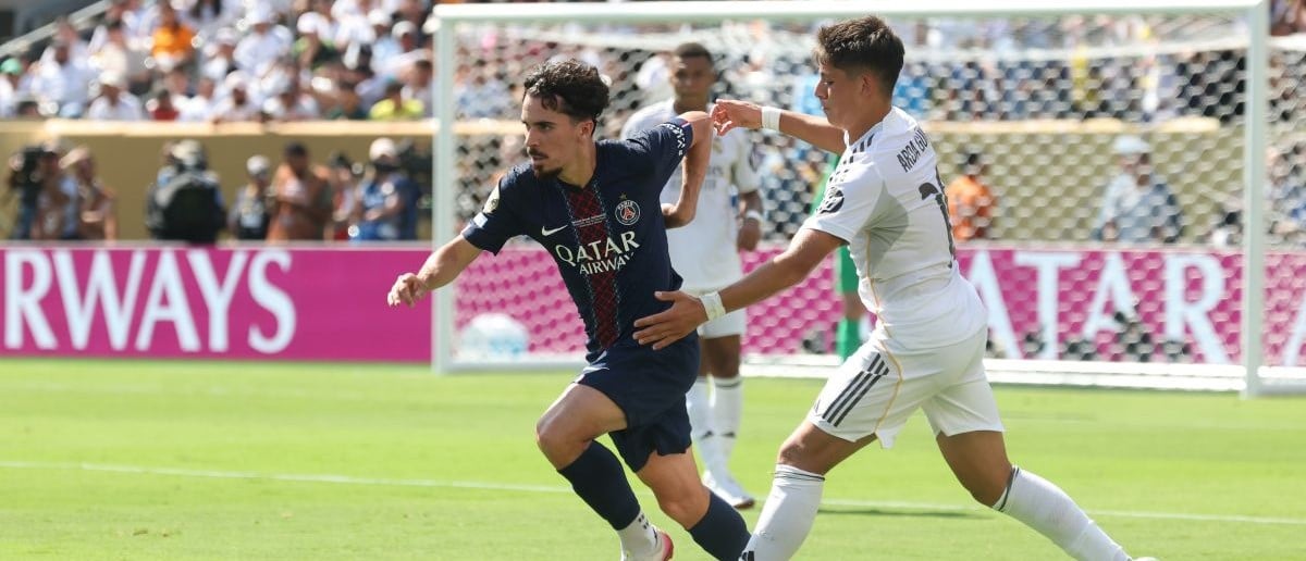 Paris Saint-Germain midfielder Vitinha (17) dribbles the ball against Real Madrid CF midfielder Arda Guler (15) during the first half during a semifinal match of the 2025 FIFA Club World Cup at MetLife Stadium