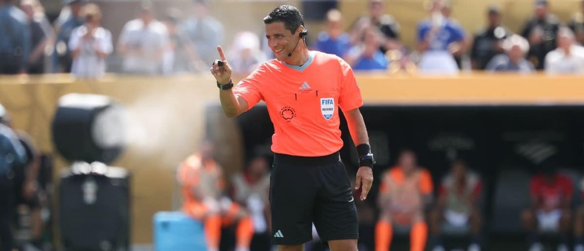 Referee Alireza Faghani gestures during the final of the 2025 FIFA Club World Cup between Paris Saint-Germain and Chelsea FC at MetLife Stadium.