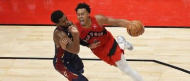 Toronto Raptors guard Scottie Barnes (4) drives to the net against Cleveland Cavaliers guard Donovan Mitchell (45) during the second half at Scotiabank Arena.