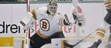 Boston Bruins goaltender Jeremy Swayman (1) makes a glove save on a Dallas Stars shot during the first period at the American Airlines Center.